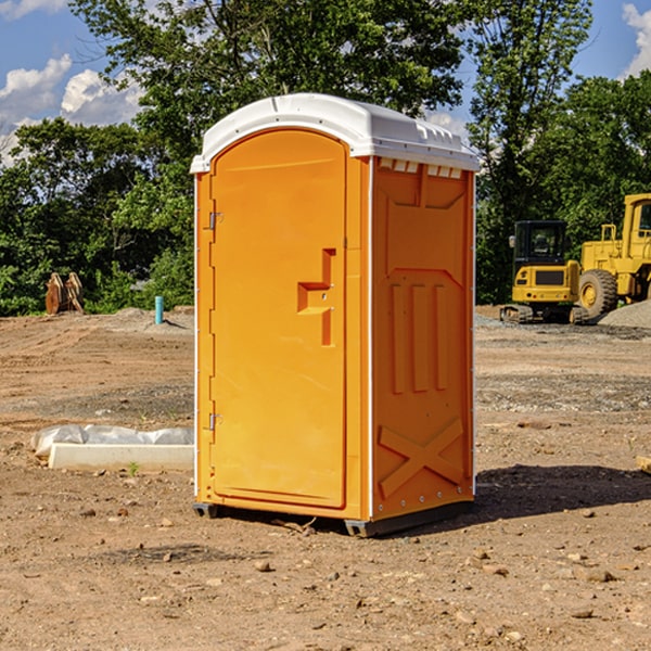 what is the cost difference between standard and deluxe portable restroom rentals in Cory